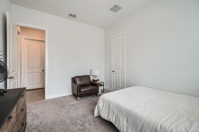 bedroom featuring carpet flooring, visible vents, and baseboards