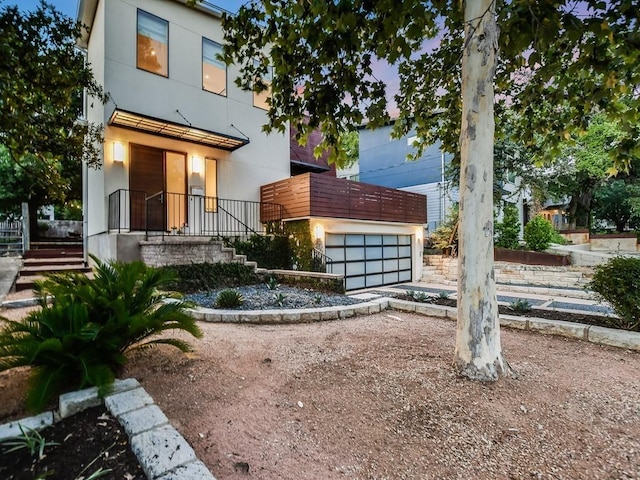 2312 W 8th St, Austin, TX 78703 - modern home with a garage, stairs, and driveway