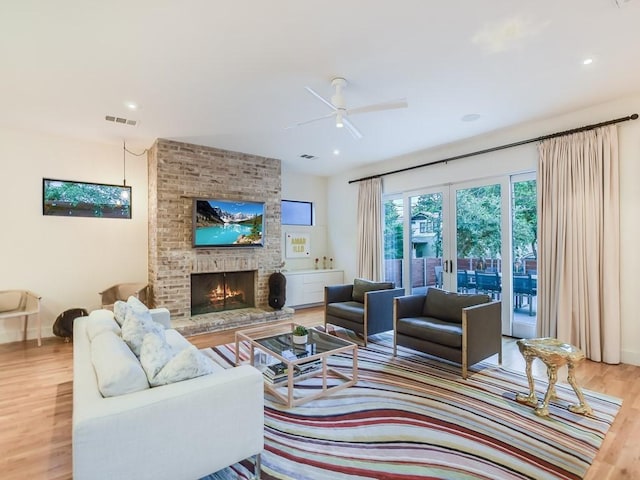 2312 W 8th St, Austin, TX 78703 - living area featuring wood finished floors, ceiling fan, a fireplace, french doors, and recessed lighting