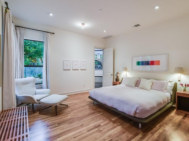 2312 W 8th St, Austin, TX 78703 - bedroom with light wood-style floors, recessed lighting, and baseboards