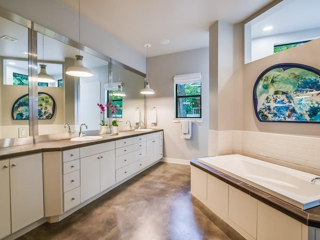 2312 W 8th St, Austin, TX 78703 - full bath with concrete floors, double vanity, and a garden tub