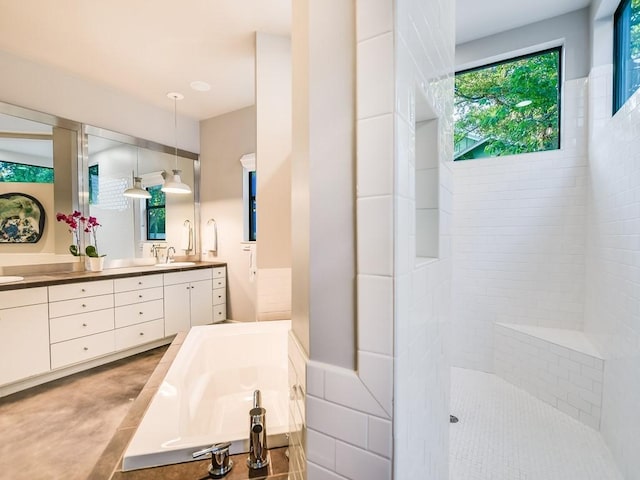 2312 W 8th St, Austin, TX 78703 - bathroom featuring double vanity, a garden tub, and a tile shower