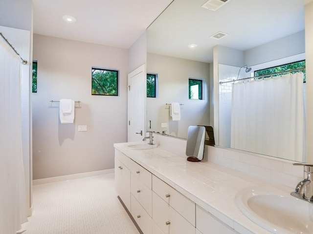 2312 W 8th St, Austin, TX 78703 - bathroom featuring double vanity, a shower with shower curtain, baseboards, and recessed lighting