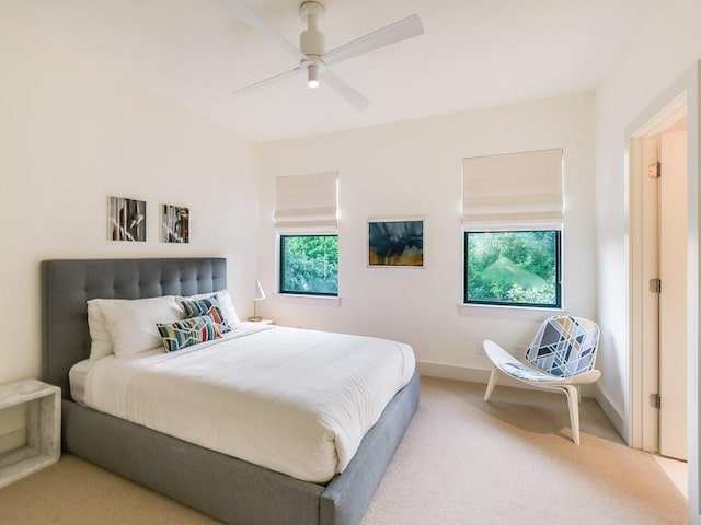 2312 W 8th St, Austin, TX 78703 - carpeted bedroom featuring a ceiling fan and baseboards