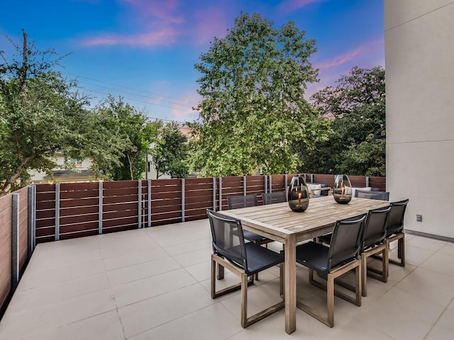 2312 W 8th St, Austin, TX 78703 - patio terrace at dusk featuring a patio area and outdoor dining space