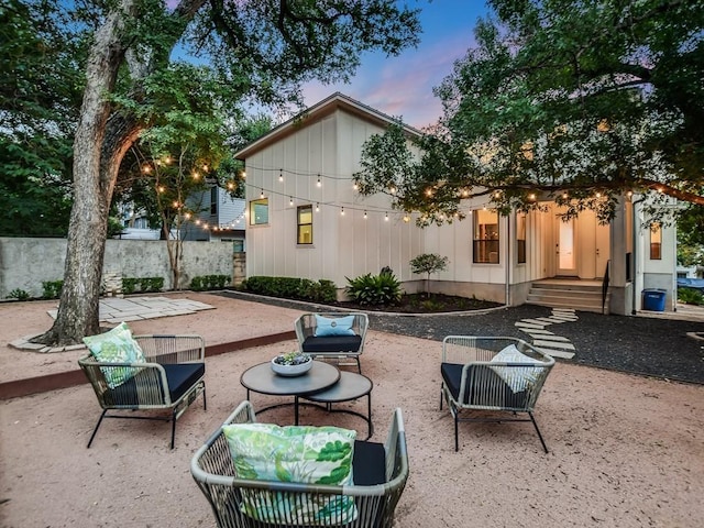 2312 W 8th St, Austin, TX 78703 - back of house at dusk featuring a patio area