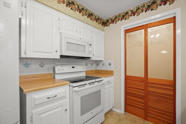 kitchen with light countertops, decorative backsplash, white cabinetry, a textured ceiling, and white appliances