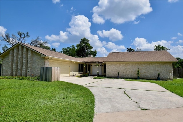 9413 Sherbrooke St, Austin, TX 78729 - view of front of house with an attached garage, a front lawn, driveway, and brick siding