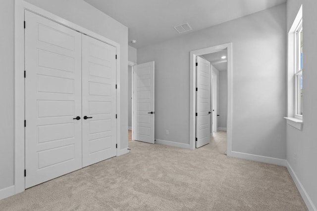 11 Doverland Dr, Lakeway, TX 78738 - unfurnished bedroom with carpet flooring, a closet, and baseboards