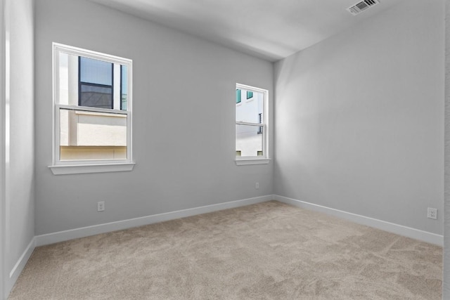 11 Doverland Dr, Lakeway, TX 78738 - spare room featuring healthy amount of natural light, carpet, and baseboards