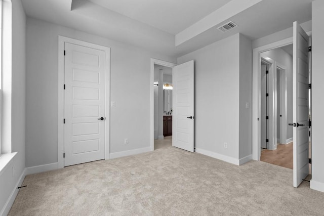 11 Doverland Dr, Lakeway, TX 78738 - unfurnished bedroom with light colored carpet, baseboards, and ensuite bathroom