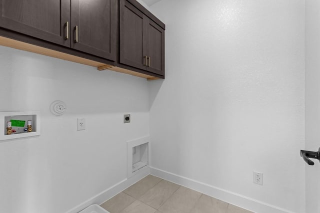 11 Doverland Dr, Lakeway, TX 78738 - washroom with cabinet space, electric dryer hookup, hookup for a washing machine, hookup for a gas dryer, and light tile patterned flooring