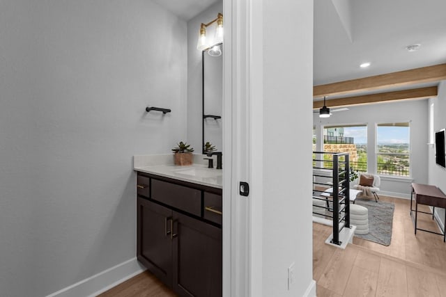 11 Doverland Dr, Lakeway, TX 78738 - bathroom with vanity, baseboards, wood finished floors, recessed lighting, and a ceiling fan