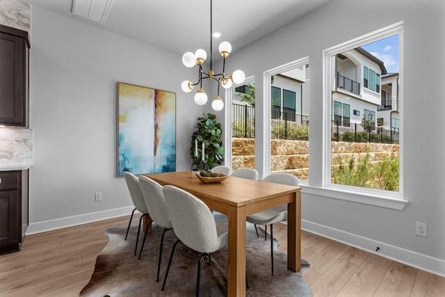 11 Doverland Dr, Lakeway, TX 78738 - dining space with healthy amount of natural light, light wood finished floors, and baseboards