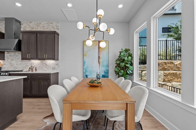 11 Doverland Dr, Lakeway, TX 78738 - dining space featuring recessed lighting, light wood-type flooring, a chandelier, and baseboards