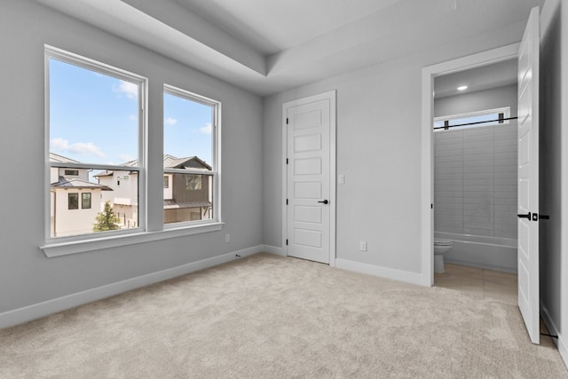 11 Doverland Dr, Lakeway, TX 78738 - unfurnished bedroom with carpet flooring, baseboards, ensuite bathroom, and recessed lighting