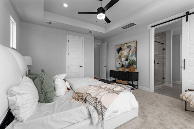 11 Doverland Dr, Lakeway, TX 78738 - bedroom featuring a raised ceiling, a barn door, carpet floors, baseboards, and recessed lighting