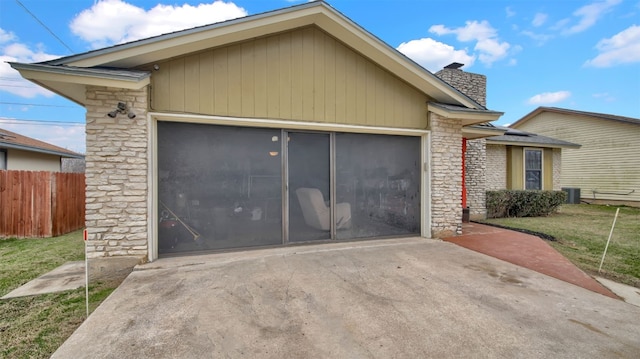 1713 Parkside Cir, Round Rock, TX 78664 - view of front facade featuring stone siding, driveway, a garage, and a chimney