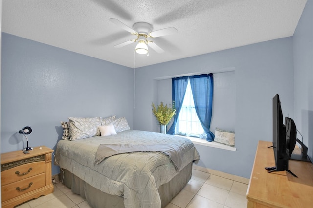 1713 Parkside Cir, Round Rock, TX 78664 - bedroom featuring light tile patterned floors, a textured ceiling, and ceiling fan