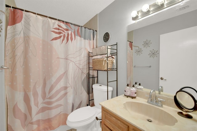 bathroom with toilet, visible vents, a textured ceiling, and vanity