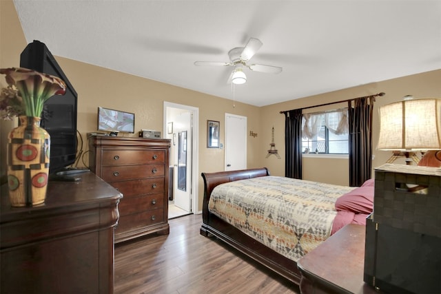 bedroom with wood finished floors and a ceiling fan