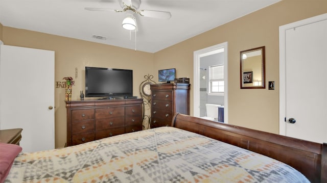 bedroom featuring visible vents, ceiling fan, and ensuite bathroom