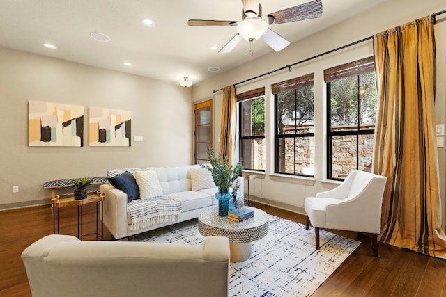 living area featuring ceiling fan, baseboards, dark wood finished floors, and recessed lighting