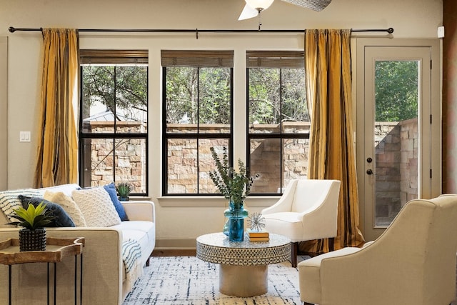 interior space with ceiling fan and plenty of natural light