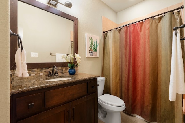 full bath with tasteful backsplash, tile patterned flooring, vanity, and toilet