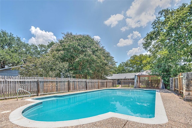 view of swimming pool with a gazebo, a fenced backyard, and a fenced in pool