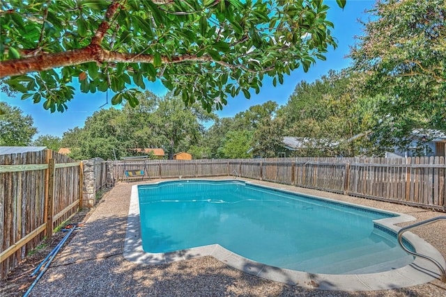 view of swimming pool featuring a fenced backyard and a fenced in pool