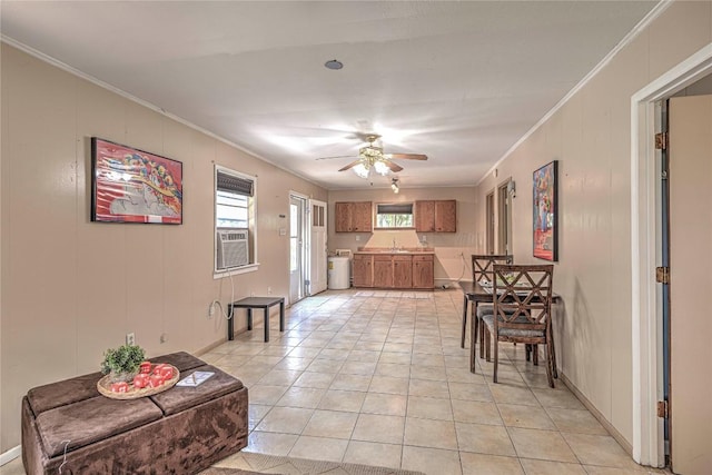 dining room with ornamental molding, cooling unit, ceiling fan, and light tile patterned floors