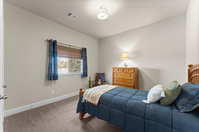 carpeted bedroom with baseboards and visible vents