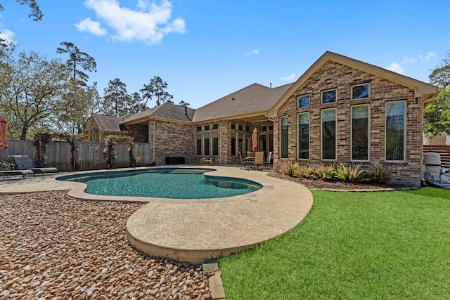 view of pool featuring a fenced in pool, a yard, a patio area, and fence