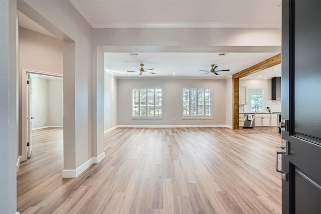 102 Blue Sky Ct, Georgetown, TX 78633 - unfurnished living room with ceiling fan, light wood-type flooring, and ornamental molding