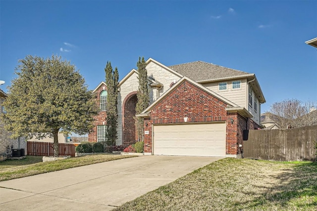 1003 Preserve Pl, Round Rock, TX 78665 - traditional-style house with concrete driveway, central AC unit, brick siding, and an attached garage