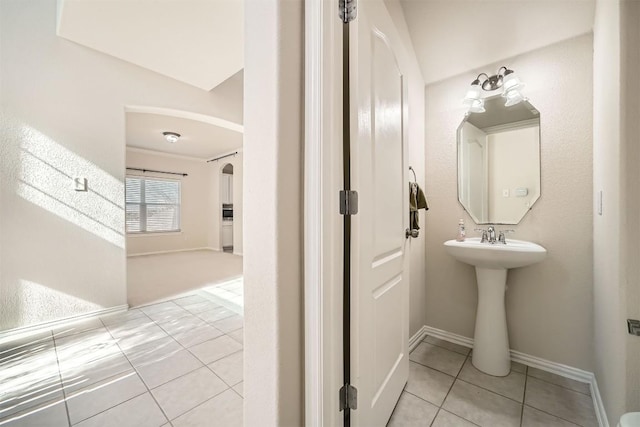 1003 Preserve Pl, Round Rock, TX 78665 - bathroom featuring tile patterned floors, baseboards, and a sink