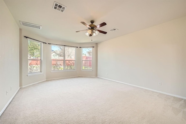 1003 Preserve Pl, Round Rock, TX 78665 - spare room with light colored carpet, baseboards, and ceiling fan