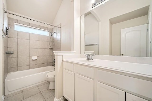 1003 Preserve Pl, Round Rock, TX 78665 - bathroom with toilet, vanity, tile patterned floors, washtub / shower combination, and vaulted ceiling