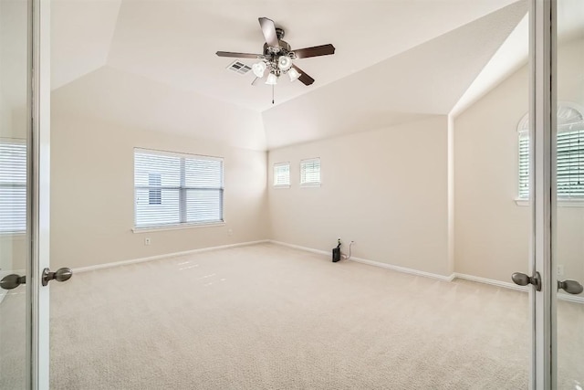 1003 Preserve Pl, Round Rock, TX 78665 - carpeted empty room featuring vaulted ceiling, ceiling fan, baseboards, and french doors