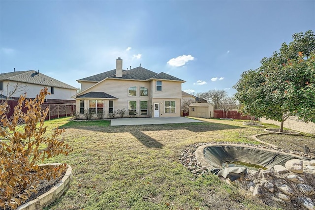 1003 Preserve Pl, Round Rock, TX 78665 - rear view of house with a patio area, a chimney, and roof with shingles