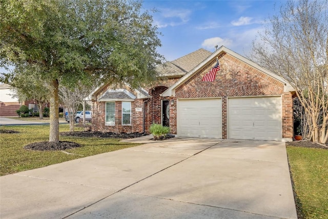 view of front facade featuring a garage, brick siding, a shingled roof, driveway, and a front lawn