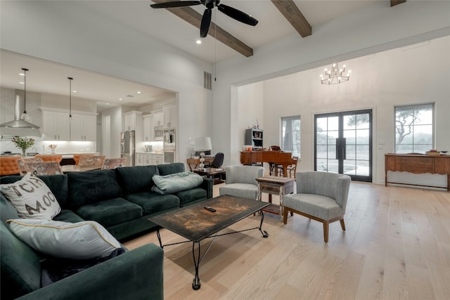521 Wonderstruck, Liberty Hill, TX 78642 - living area featuring beam ceiling, light wood-style flooring, ceiling fan, a towering ceiling, and a chandelier
