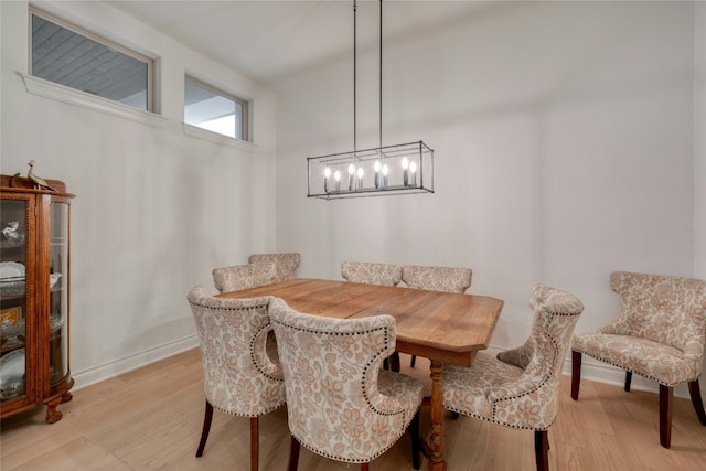 521 Wonderstruck, Liberty Hill, TX 78642 - dining area featuring light wood-type flooring and a chandelier