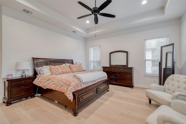 521 Wonderstruck, Liberty Hill, TX 78642 - bedroom featuring light wood-style flooring, recessed lighting, a raised ceiling, and ceiling fan