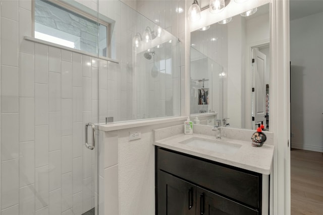 521 Wonderstruck, Liberty Hill, TX 78642 - full bathroom featuring a shower stall, vanity, and wood finished floors