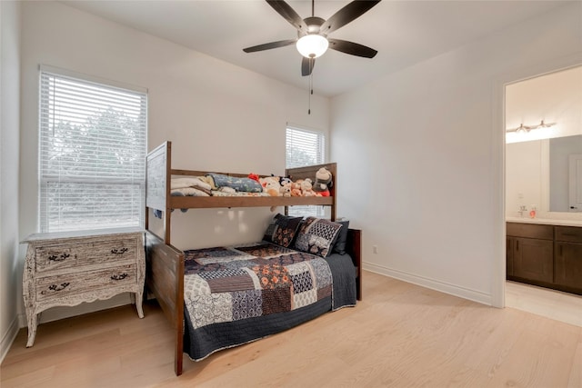 521 Wonderstruck, Liberty Hill, TX 78642 - bedroom with light wood-style flooring, ensuite bathroom, and a ceiling fan