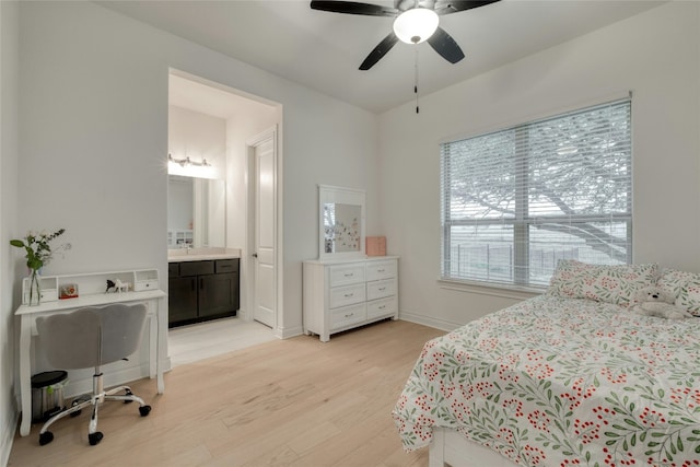 521 Wonderstruck, Liberty Hill, TX 78642 - bedroom with light wood finished floors, ensuite bath, and ceiling fan