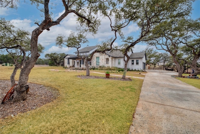 521 Wonderstruck, Liberty Hill, TX 78642 - view of front facade featuring a front lawn and driveway
