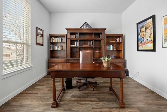 office area with dark wood-style floors and baseboards